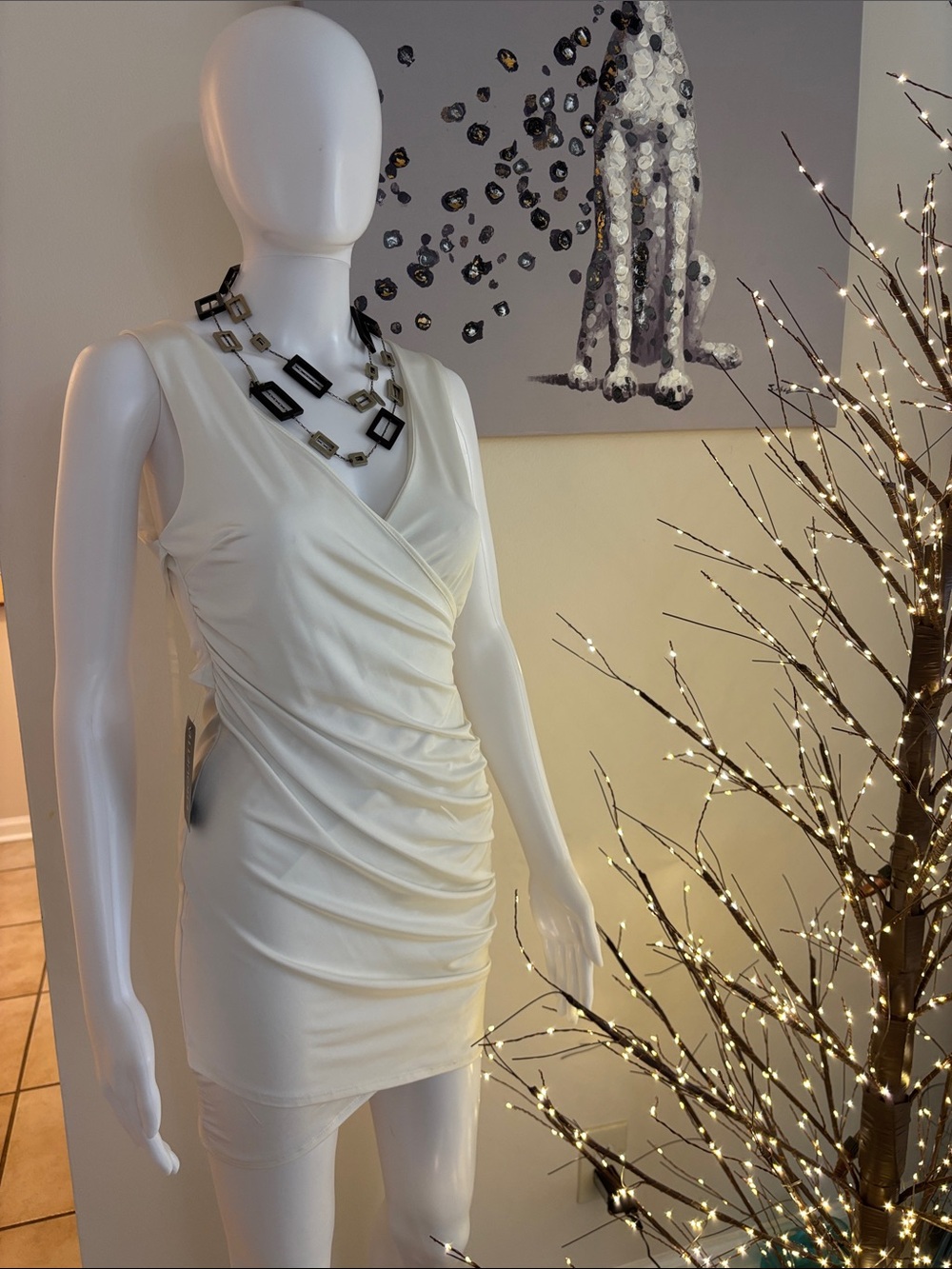 Etiquette Clothiers Ivory Sleeveless Ruched Wrap Mini Dress